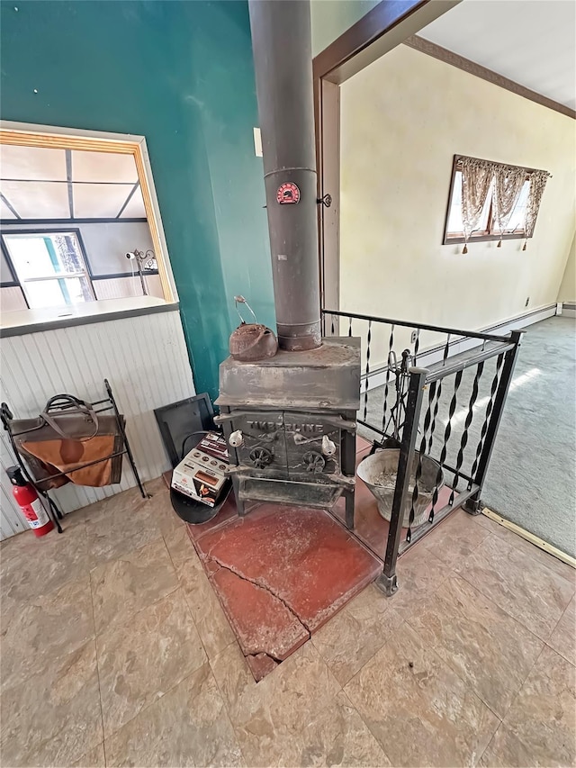 dining space with a wood stove