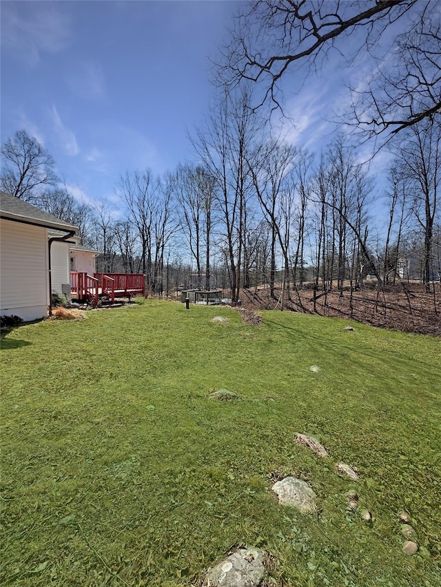 view of yard with a wooden deck