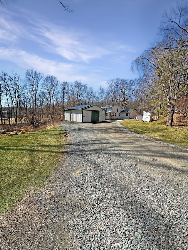 exterior space with gravel driveway