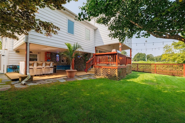 exterior space featuring a wooden deck and a fenced backyard