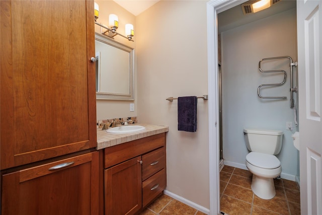 full bath with a shower with shower door, toilet, tile patterned flooring, baseboards, and vanity