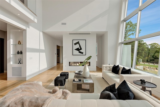 68 Root Ave, Carmel, NY 10509 - living area with a towering ceiling and light wood-style floors