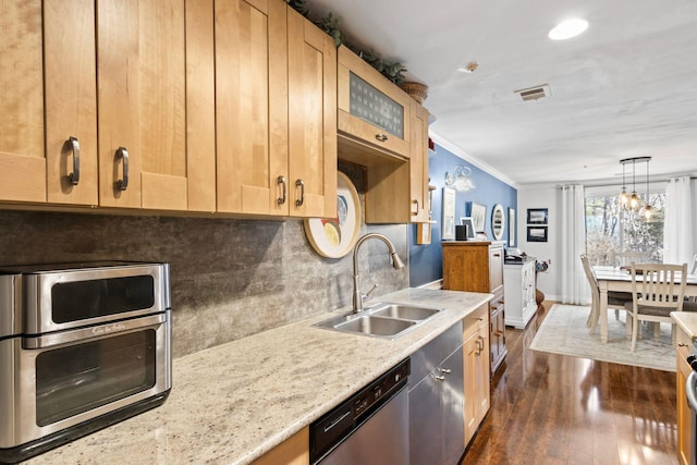 kitchen featuring a sink, tasteful backsplash, stainless steel dishwasher, dark wood finished floors, and crown molding