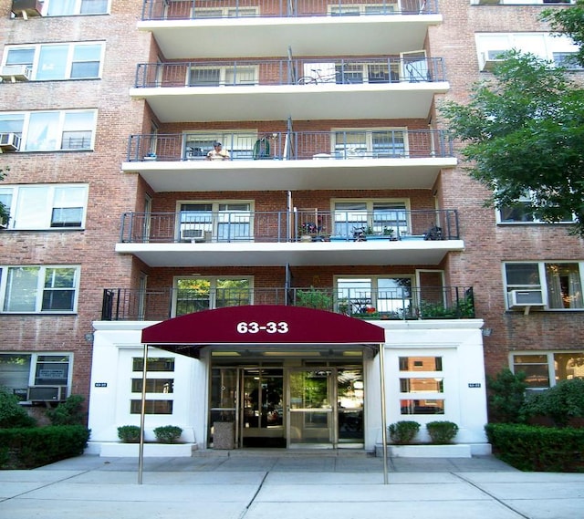 view of building exterior with cooling unit