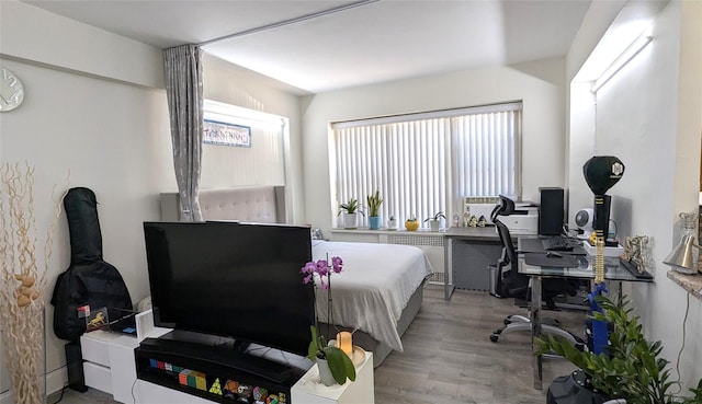 bedroom featuring light wood finished floors