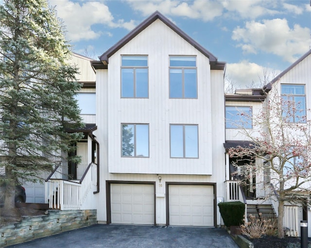 view of front of house featuring aphalt driveway and a garage