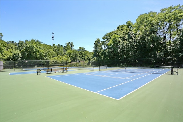 view of sport court featuring community basketball court and fence