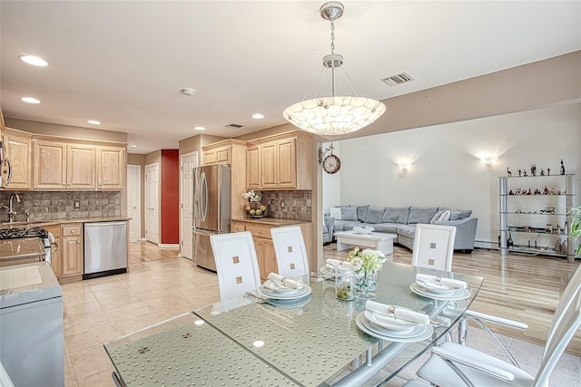 dining area with light tile patterned floors, visible vents, recessed lighting, and baseboards