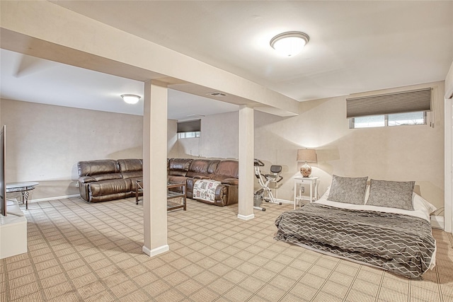 basement with visible vents and baseboards