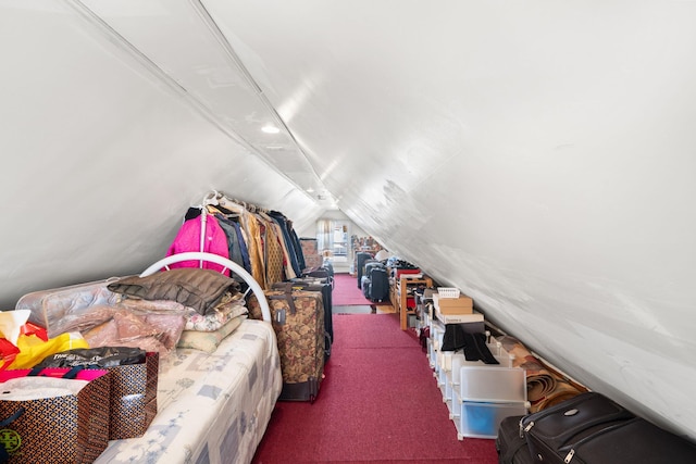 carpeted bedroom with vaulted ceiling