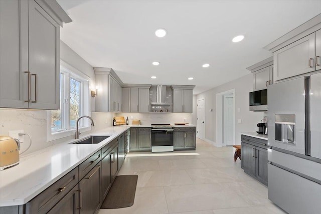 kitchen featuring tasteful backsplash, wall chimney range hood, refrigerator with ice dispenser, electric stove, and a sink