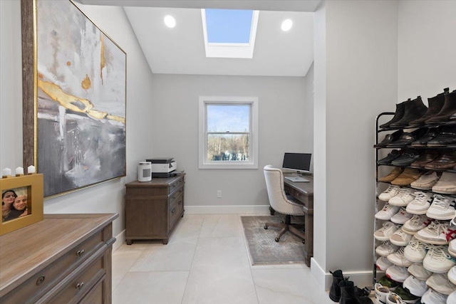 office featuring a skylight, light tile patterned floors, recessed lighting, and baseboards