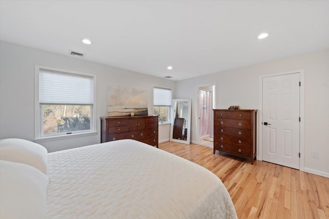 bedroom featuring visible vents, recessed lighting, light wood-type flooring, and baseboards