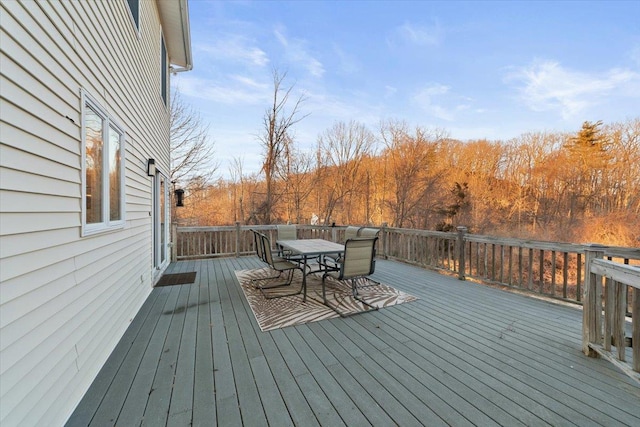 wooden terrace with outdoor dining area