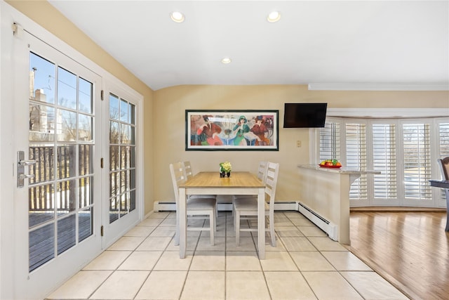 dining space featuring light tile patterned flooring, recessed lighting, a healthy amount of sunlight, and baseboard heating