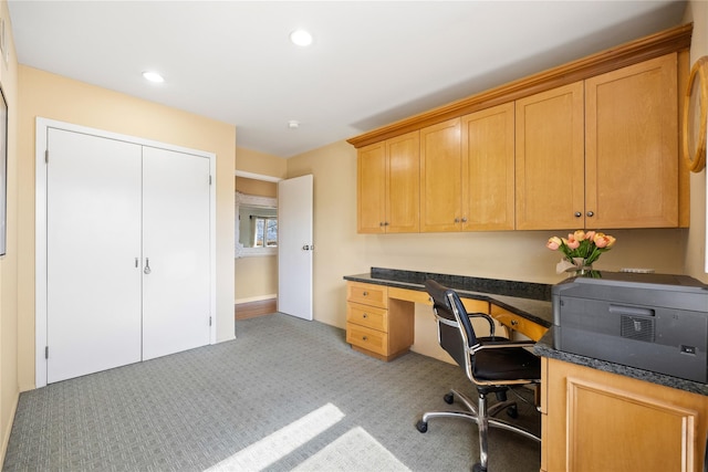 office area with recessed lighting, built in desk, and light carpet