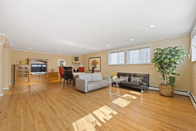 living room with baseboards, light wood finished floors, recessed lighting, ornamental molding, and baseboard heating