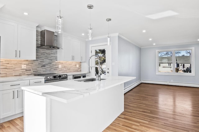 kitchen featuring plenty of natural light, backsplash, stainless steel range with electric stovetop, and wall chimney range hood