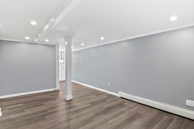 below grade area featuring a baseboard heating unit, wood finished floors, and crown molding