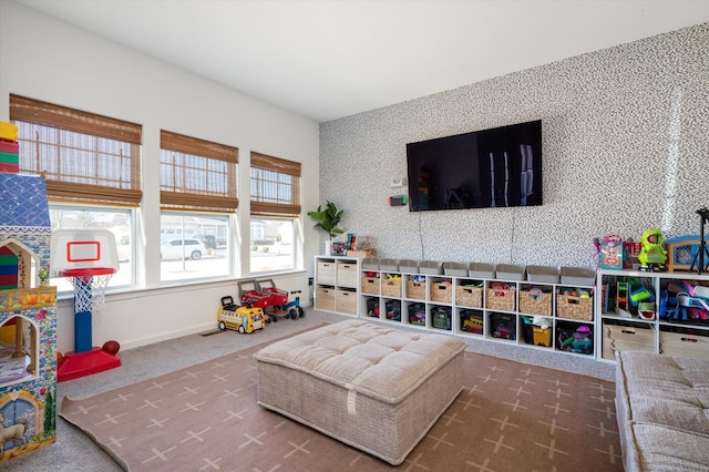 recreation room featuring carpet flooring, wallpapered walls, and baseboards