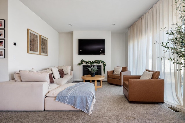 living room featuring carpet and visible vents