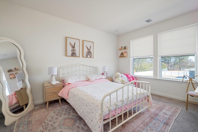 bedroom with visible vents, baseboards, and carpet flooring