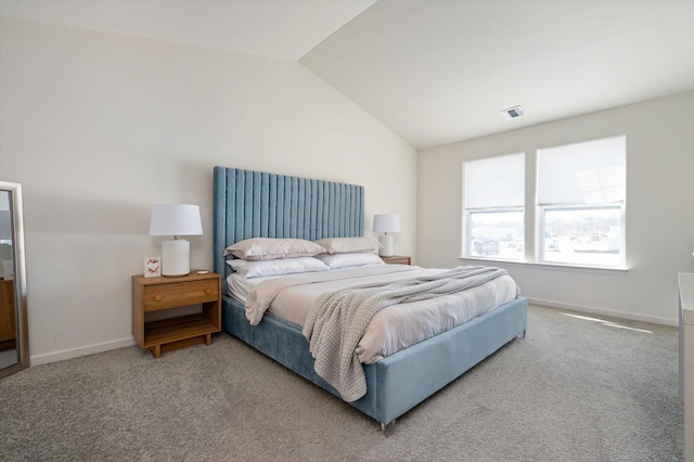 bedroom with visible vents, carpet floors, baseboards, and vaulted ceiling