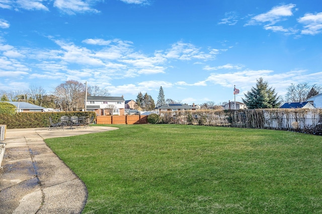 view of yard with a patio and fence