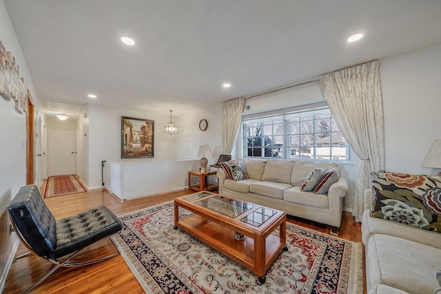 living area featuring attic access, recessed lighting, and wood finished floors