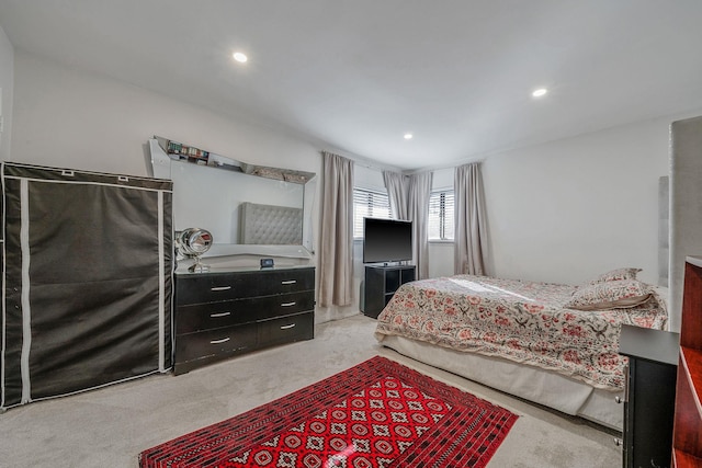 carpeted bedroom with recessed lighting