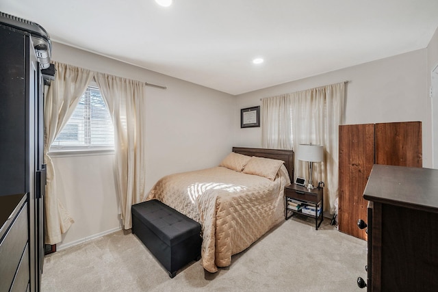 bedroom featuring recessed lighting, baseboards, and light colored carpet