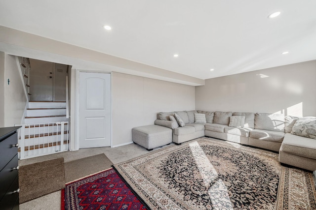 carpeted living room with recessed lighting and stairs