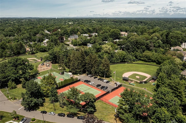 drone / aerial view with a wooded view