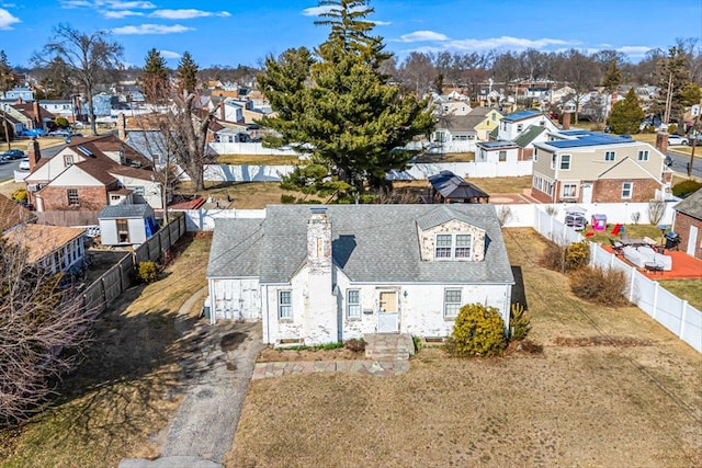 birds eye view of property with a residential view