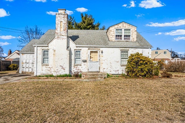 view of front of property with a chimney, roof with shingles, a front lawn, and fence