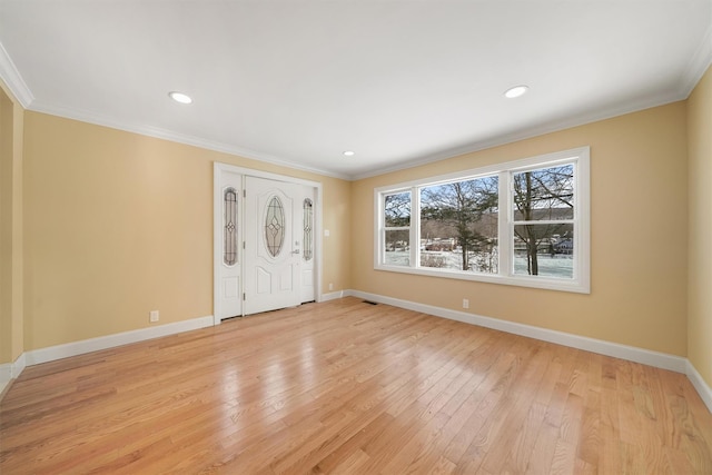 entryway featuring recessed lighting, light wood-style flooring, crown molding, and baseboards