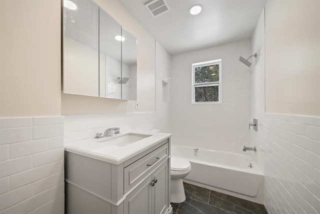 full bath featuring visible vents, toilet, tile walls,  shower combination, and vanity