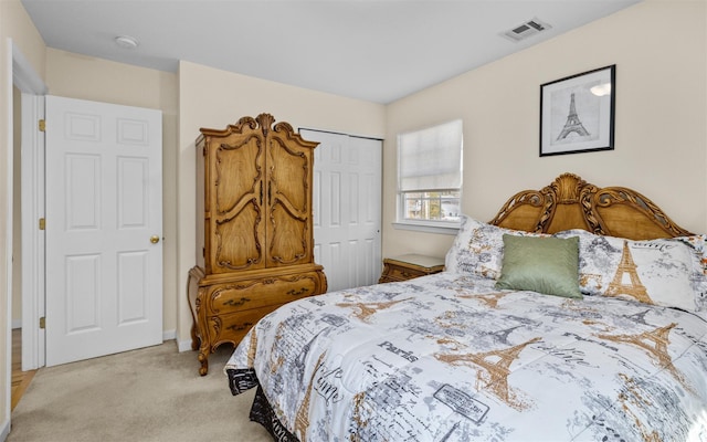 bedroom featuring light carpet, visible vents, and a closet