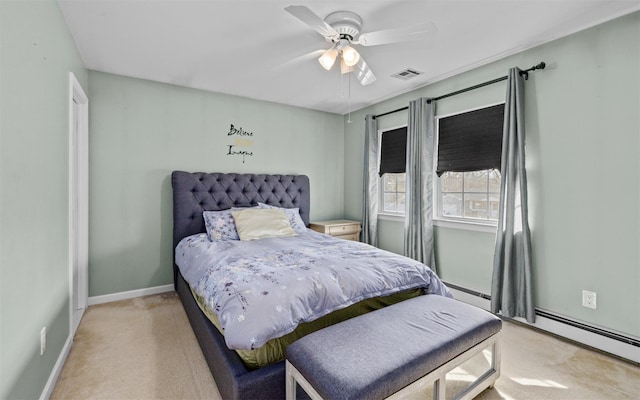 bedroom featuring a ceiling fan, baseboards, visible vents, light carpet, and baseboard heating