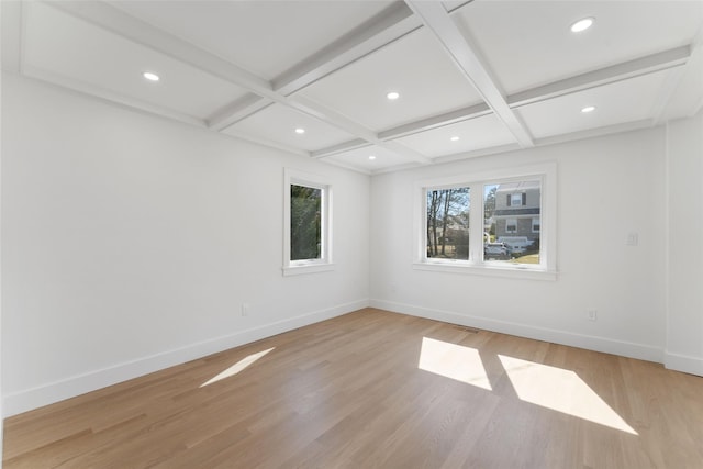 unfurnished room with baseboards, coffered ceiling, and light wood-type flooring