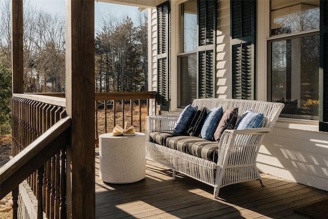 wooden deck with an outdoor hangout area