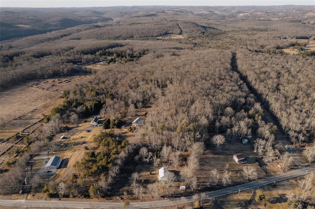 drone / aerial view featuring a view of trees