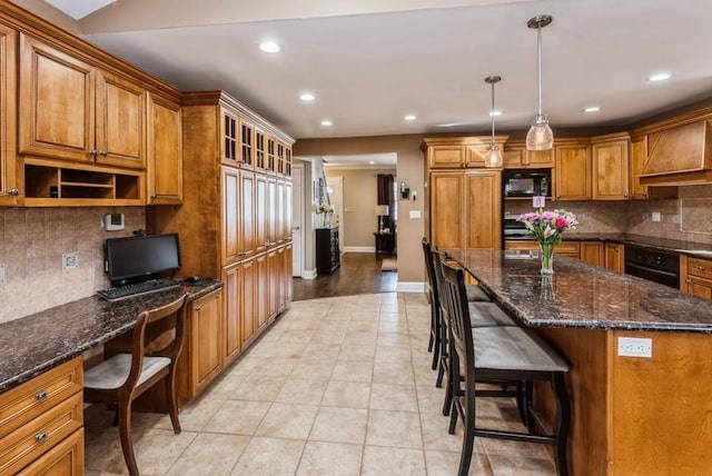 kitchen featuring black appliances, recessed lighting, light tile patterned flooring, brown cabinetry, and built in study area