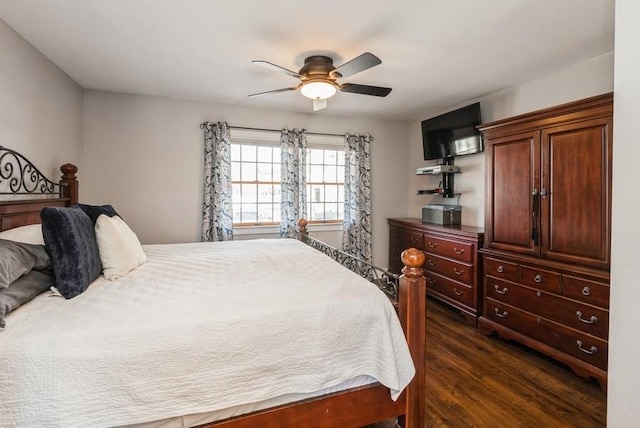 bedroom with dark wood-style floors and a ceiling fan