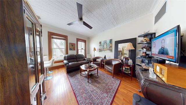 living room with light wood-style flooring and a ceiling fan