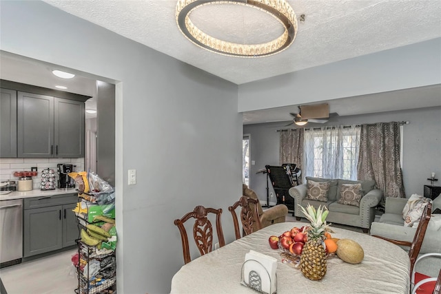 dining room with a textured ceiling and a ceiling fan