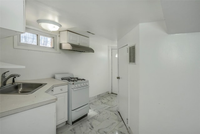 kitchen with visible vents, marble finish floor, a sink, under cabinet range hood, and white gas range