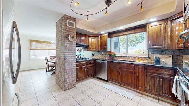 kitchen with visible vents, ornamental molding, light tile patterned floors, appliances with stainless steel finishes, and a sink