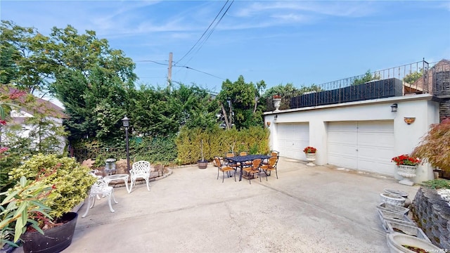 view of patio / terrace featuring a balcony and outdoor dining space