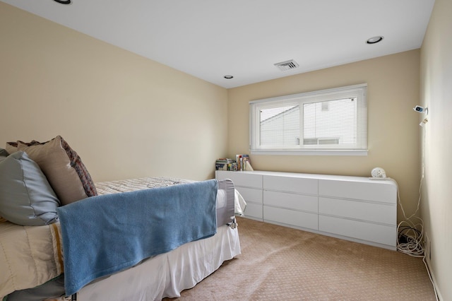 bedroom featuring recessed lighting, visible vents, and light carpet